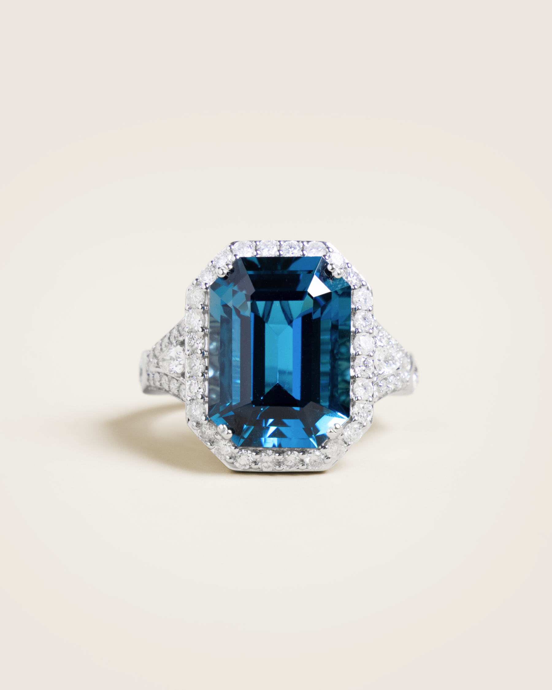 14K 12.66ct London Blue Topaz and 1.28ctw Diamond Halo Ring