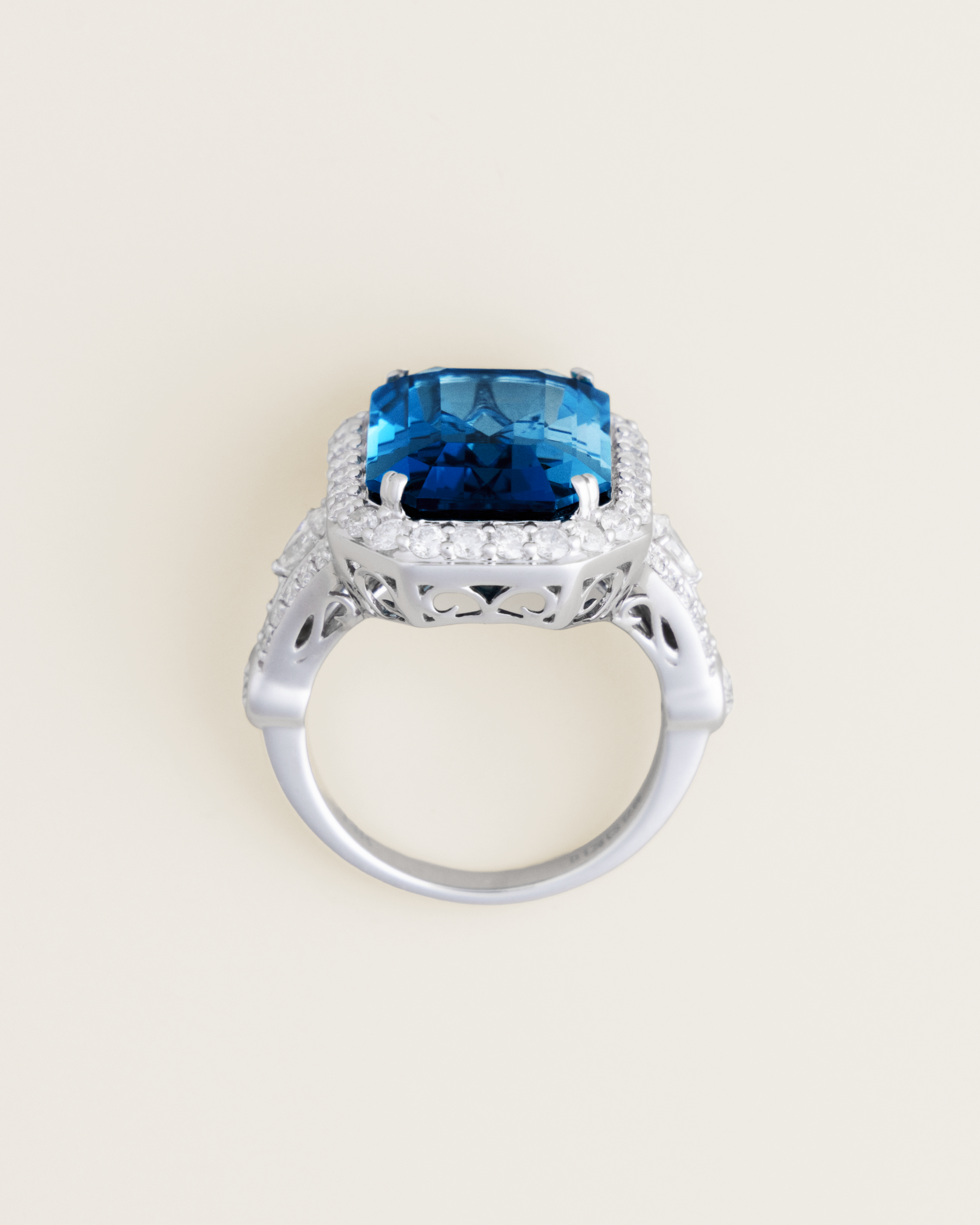 14K 12.66ct London Blue Topaz and 1.28ctw Diamond Halo Ring